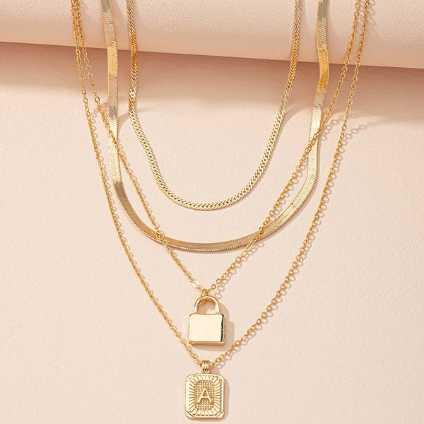 Gold Initial Letter and Lock Multi Layer Necklace in Gold Setting